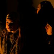 Photo of a female presenting student on a dark background