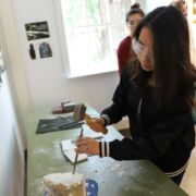 Student participating in the Borland Project Space "Rocks, Minerals and the History of Art" by Heather McCune Bruhn.