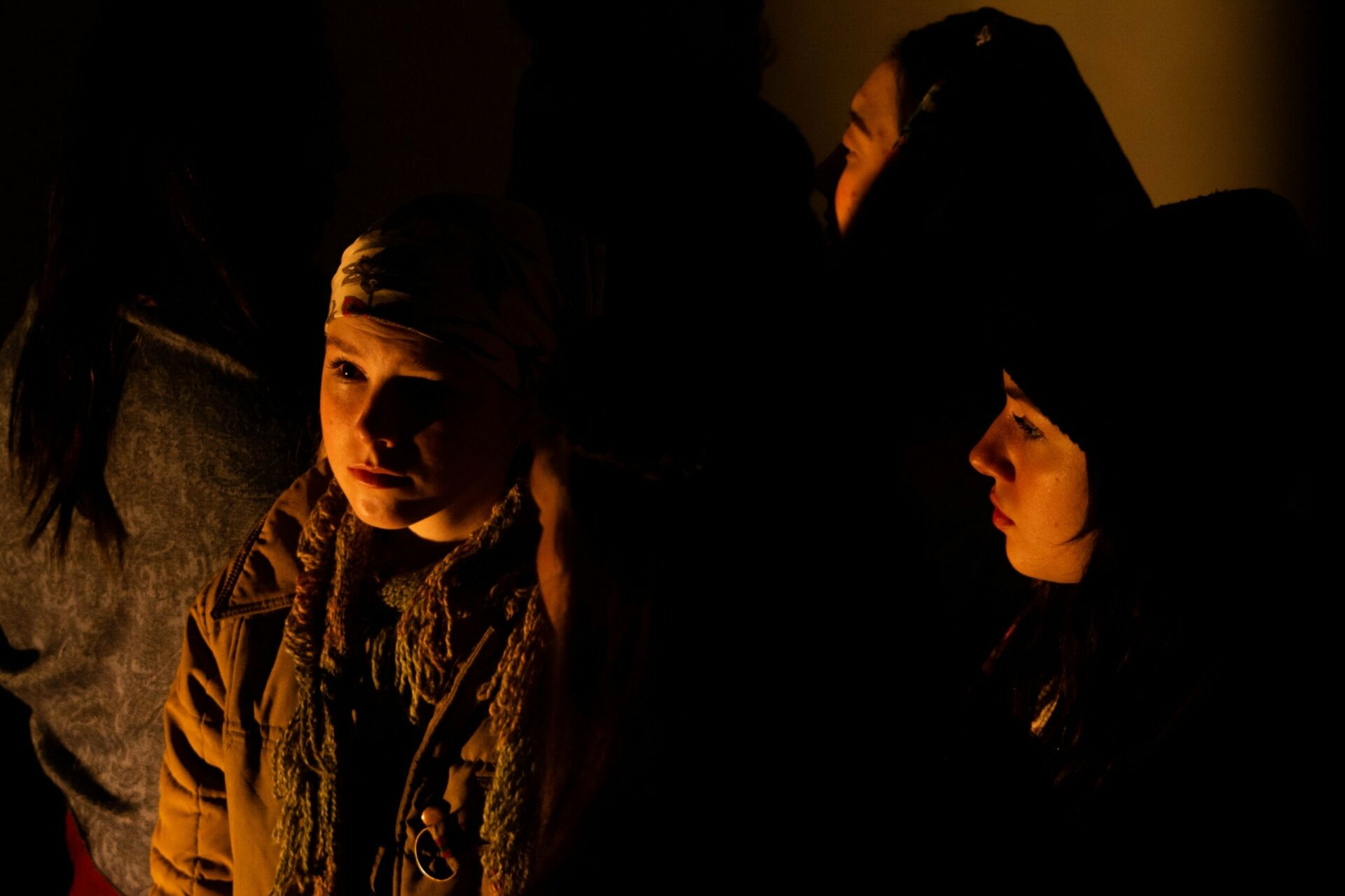 Photo of a female presenting student on a dark background