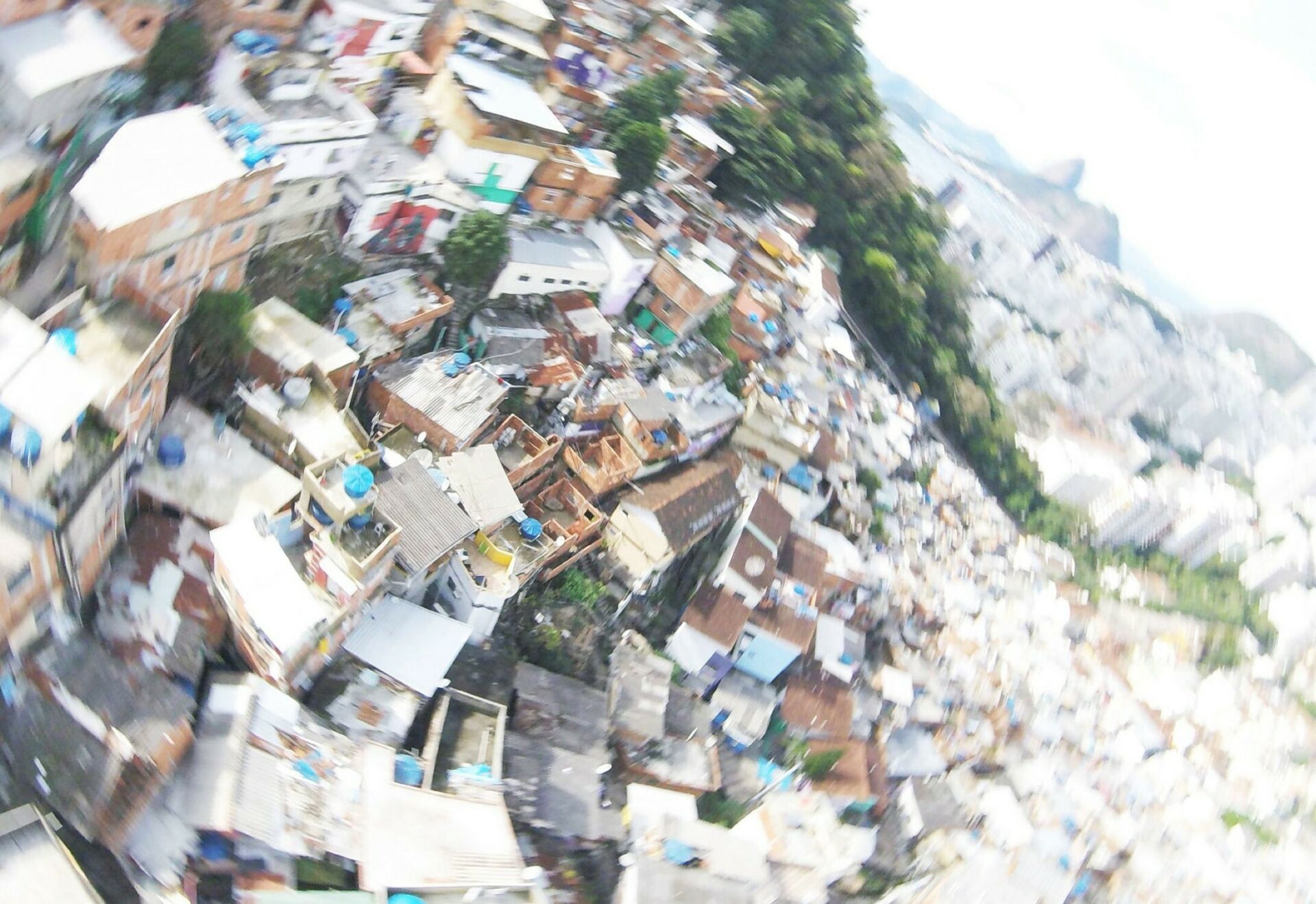 Radially blurred aerial view of favelas in Rio de Janeiro's Santa Marts hill region.