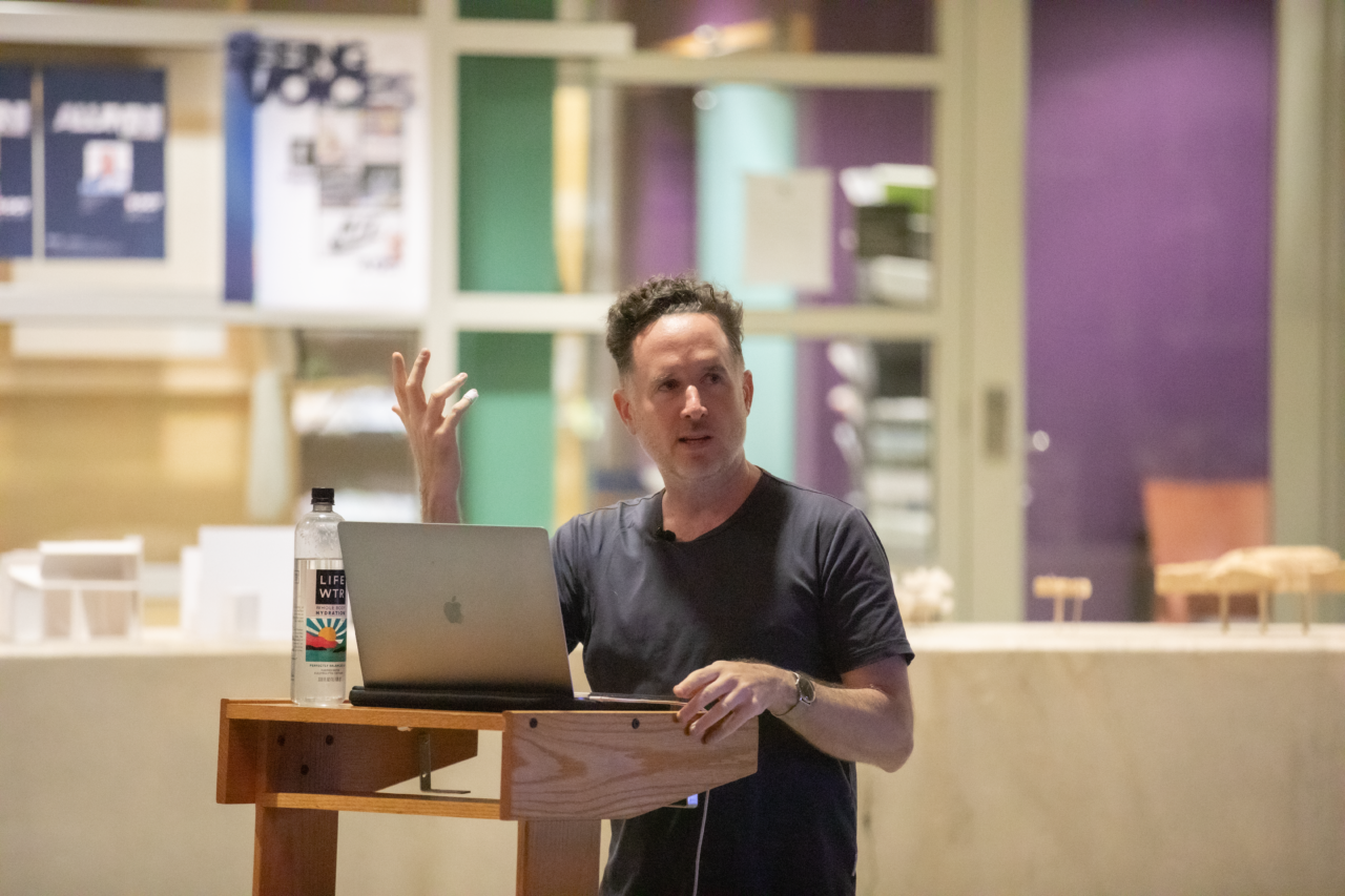 Graphic designer David Heasty giving a lecture at the podium in the Stuckeman Family Building Jury Space.