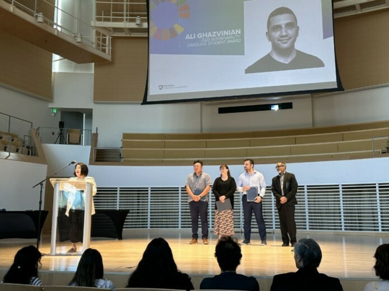 2022-2023 Sustainability Award Winners lined up on stage in the School of Music Recital Hall.