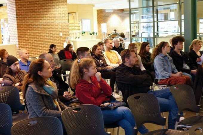 Prospective student and their parents are seated in the jury space of the Stuckeman School, listening intently during a presentation for fall visit day.