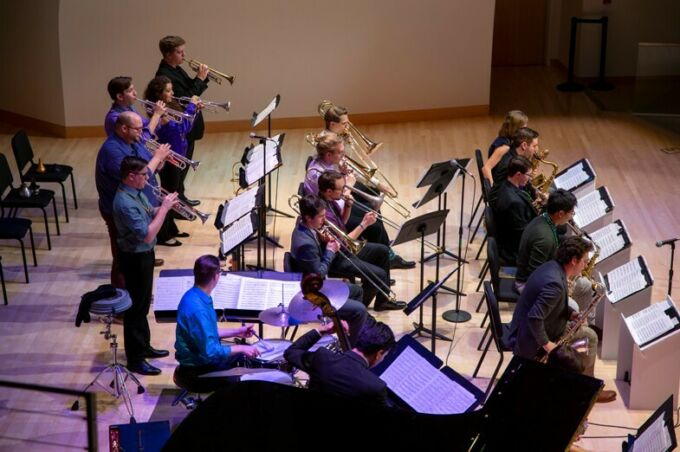 The Penn State Jazz band performs their instruments during the Mardi Gras concert.