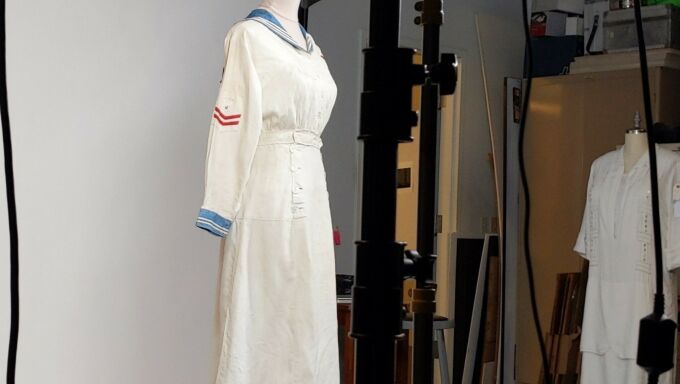 Nurse uniform from circa 1910 being photographed in a photo studio