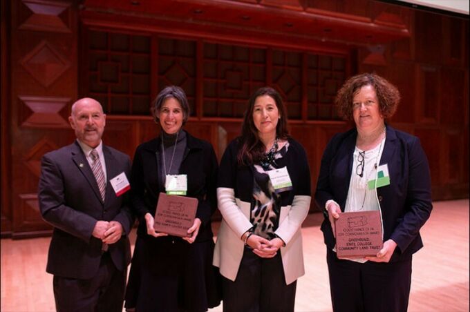 Lisa Iulo, director of the Hamer Center for Community Design (second from left) and Colleen Ritter, executive director of the State College Community Land Trust (far right) accept their award from 10,0000 Friends of Pennsylvania Board Chair Bert Cossaboon and President/CEO Stacie Reidenbaugh.