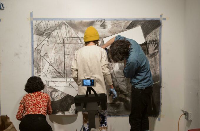 Three students participate in an exercise during the workshops at Hunter College in New York.