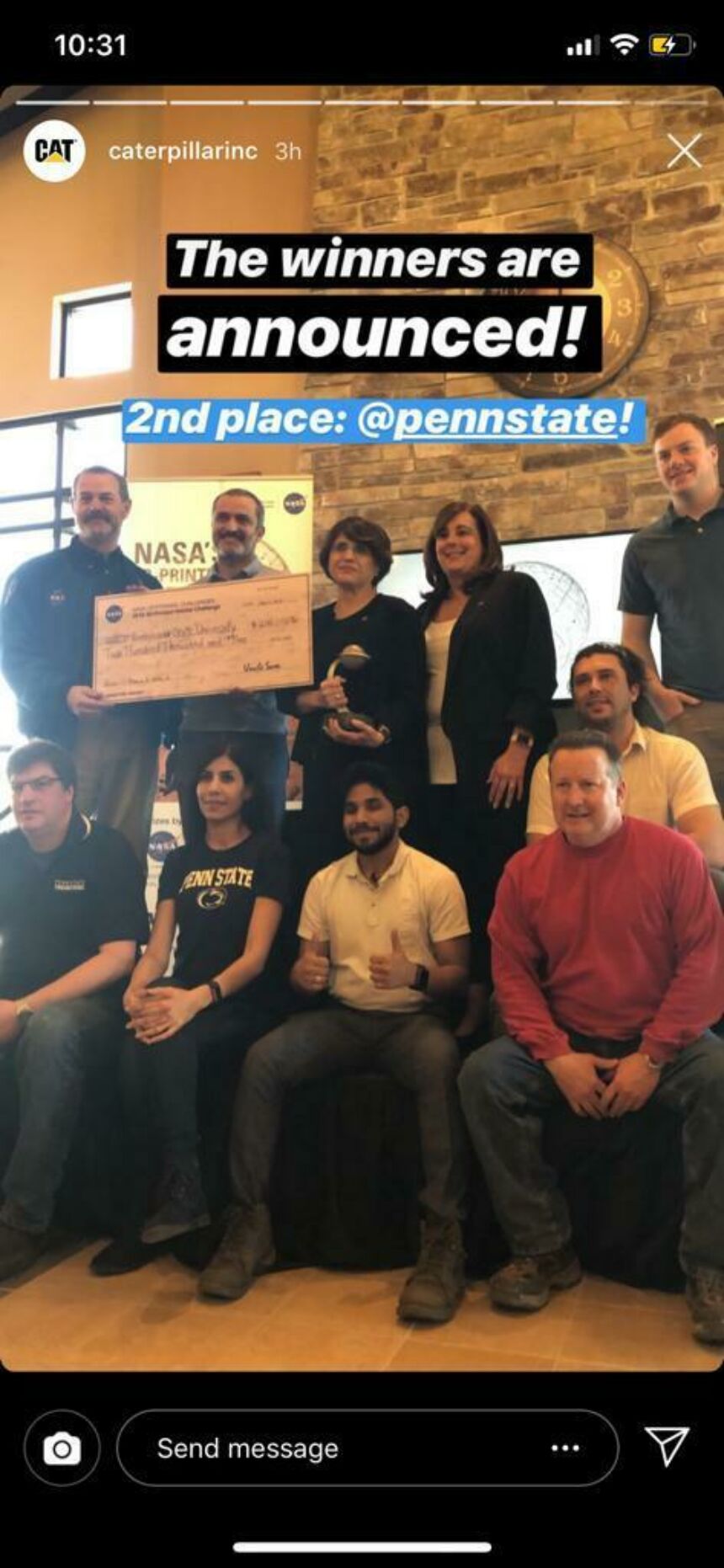 Cell phone screenshot of Penn State Mars Challenge team standing together holding large prize check